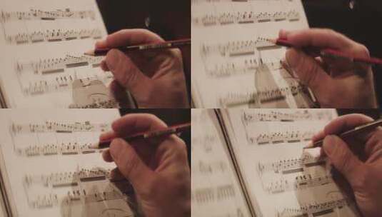 作曲家用铅笔做标记高清在线视频素材下载