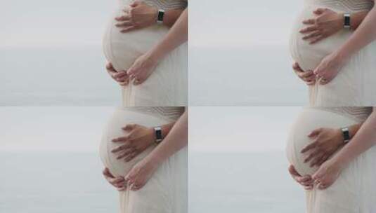 男人抚摸孕妇的肚子高清在线视频素材下载
