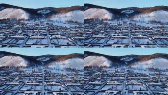 航拍兴安岭冬季日暮时分山村雪景高清在线视频素材下载