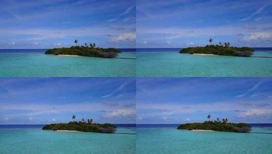 白天以上旅行拍摄的白色天堂海滩和蓝色的水背景高清在线视频素材下载