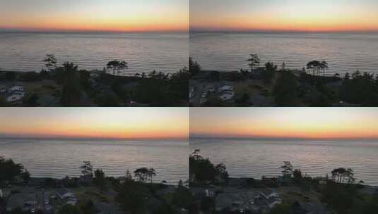 在温暖的夕阳下，惠德贝岛海滨住宅的鸟瞰图。高清在线视频素材下载