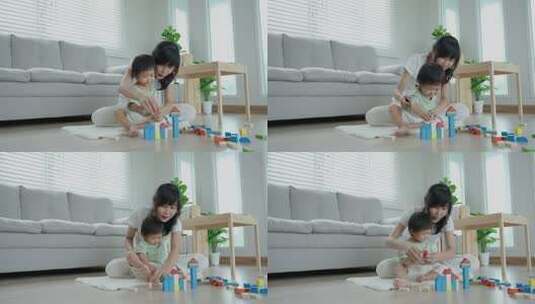 妈妈和小女孩一起玩积木高清在线视频素材下载