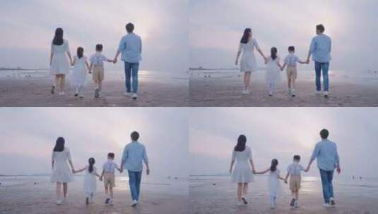 一家人幸福的海边散步高清在线视频素材下载