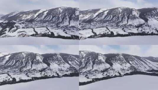 航拍新疆冬季喀纳斯湖雪景雪山森林冰河晨雾高清在线视频素材下载