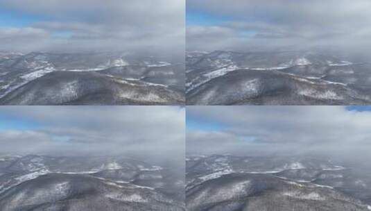 空中俯瞰被雪覆盖的连绵山脉高清在线视频素材下载