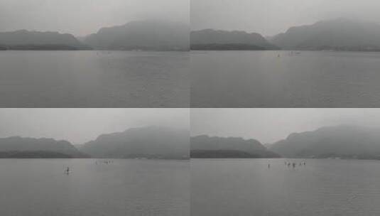 航拍雨雾阴天庐山西海水面桨板运动高清在线视频素材下载