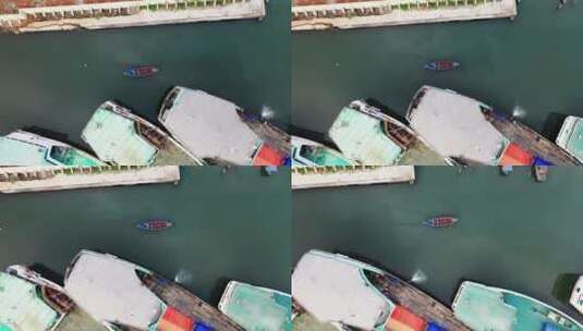 渔船在海港行驶的航拍镜头高清在线视频素材下载
