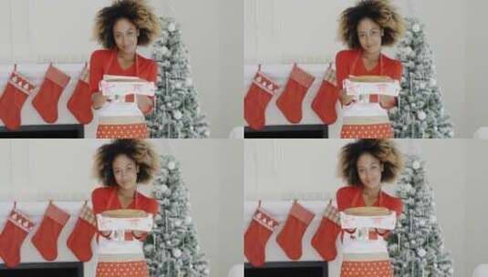 女子拿着圣诞甜点高清在线视频素材下载