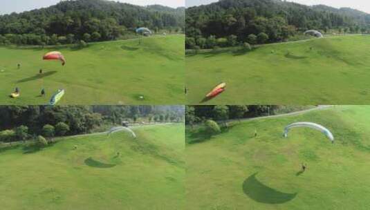 武汉滑翔伞基地航拍三个滑翔伞升起过程709高清在线视频素材下载