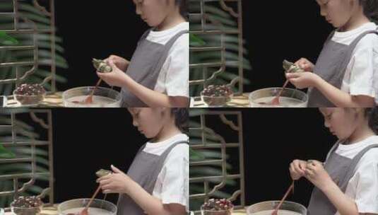 教女儿手工包制粽子的母亲高清在线视频素材下载