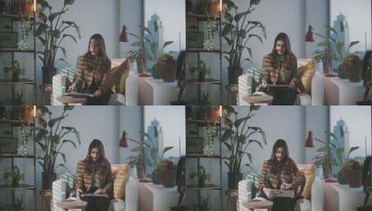 女人坐在家里打开笔记本电脑高清在线视频素材下载