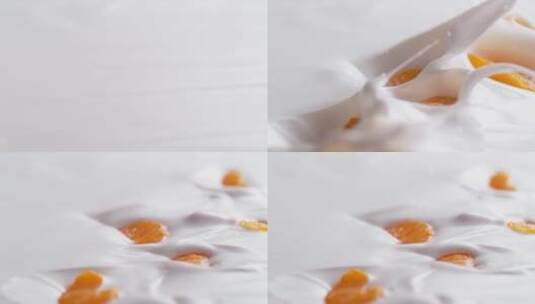 黄色果肉掉在牛奶杯里的慢镜头高清在线视频素材下载