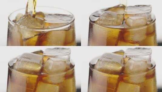 加冰的玻璃杯里倒满可乐特写高清在线视频素材下载