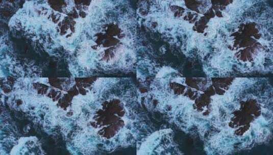 蓝色海浪撞击岩石的俯视图高清在线视频素材下载