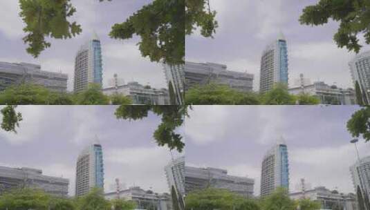 在马路上低角度拍摄摩天大楼高清在线视频素材下载