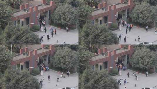 学生涌入重庆南岸区龙门浩职业中学的校门高清在线视频素材下载
