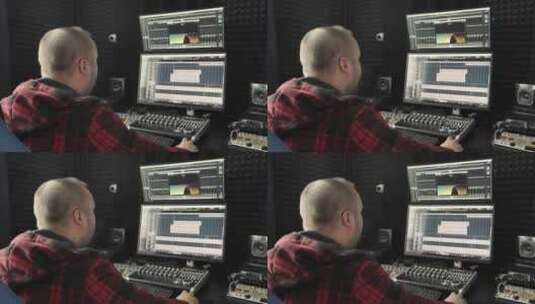 在录音棚工作的音响工程师穿着法兰绒衬衫的高清在线视频素材下载