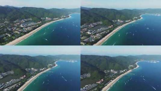 航拍三亚亚龙湾蓝天白云海浪游艇沙滩海岸线高清在线视频素材下载