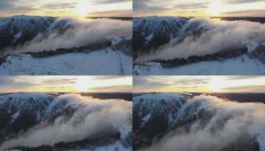 航拍云雾缭绕的雪山高清在线视频素材下载