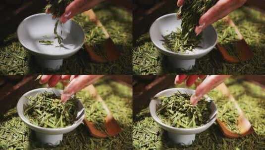 双手捧起清新的龙井茶叶绿茶顶级西湖龙井高清在线视频素材下载