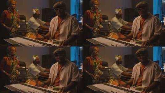 三位非裔美国爵士音乐家在录音室录制新音乐高清在线视频素材下载