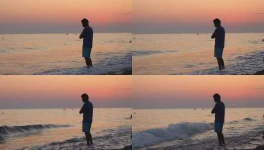 海滩上忧郁的男人剪影高清在线视频素材下载
