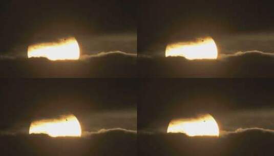 黑云层间的太阳轮廓高清在线视频素材下载