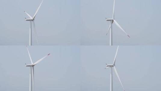 航拍蓝天下风力发电场高清在线视频素材下载