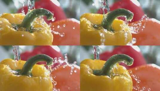 水流倒在黄椒红椒上的慢镜头高清在线视频素材下载