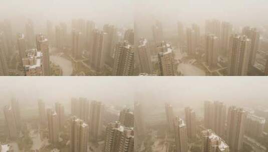 沙尘暴来袭城市建筑住宅区黄沙弥漫高清在线视频素材下载