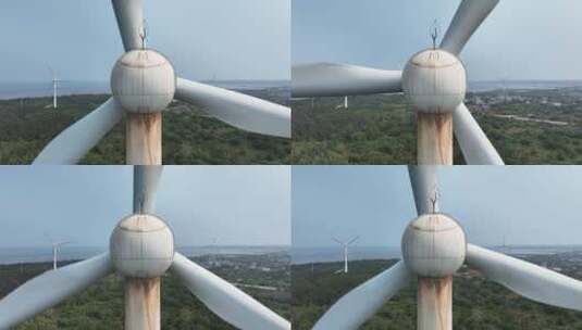 航拍森林中的风力发电风车高清在线视频素材下载
