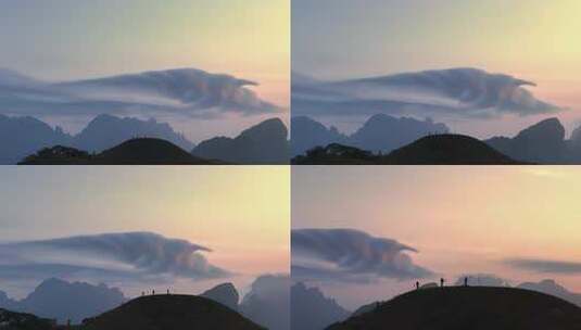 广西山顶人物攀登登顶荚状云航拍喀斯特地貌高清在线视频素材下载