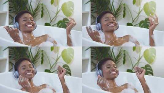 女人戴着耳机泡澡高清在线视频素材下载