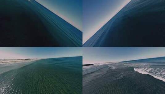航拍海边沙滩海浪冲浪蔚蓝色的大海海平面高清在线视频素材下载