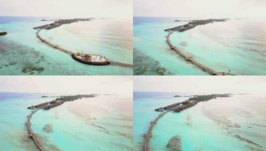 航拍海岛度假屋度假酒店沙滩大海马尔代夫高清在线视频素材下载