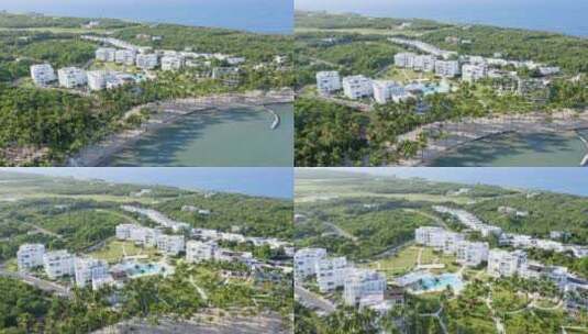 热带Playa Nueva Romana空中天桥，带沙滩和背景豪华现代公寓高清在线视频素材下载