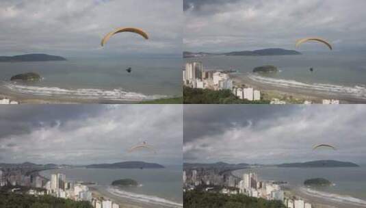 滑翔伞飞在海滩上空高清在线视频素材下载