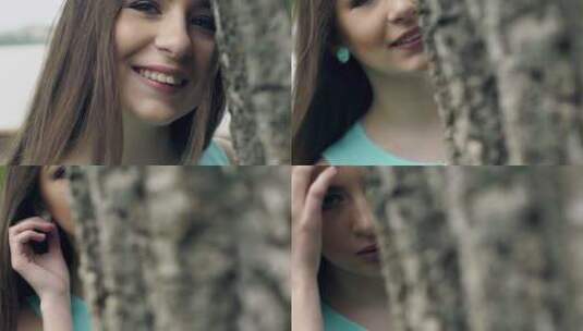 好女孩在树后微笑高清在线视频素材下载