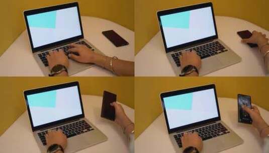 一个人在笔记本电脑上打字并检查手机高清在线视频素材下载