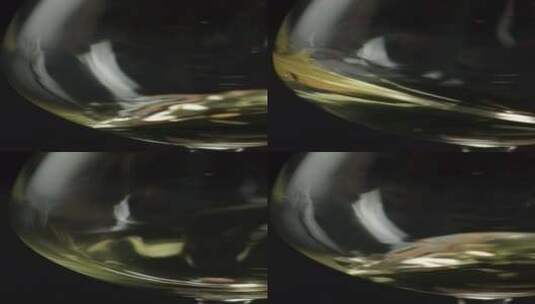 2K高速摄影酒杯中晃荡的白葡萄酒高清在线视频素材下载