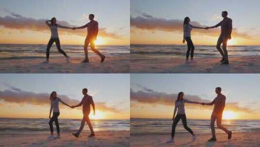 夫妇手拉手走在日落的海滩上高清在线视频素材下载