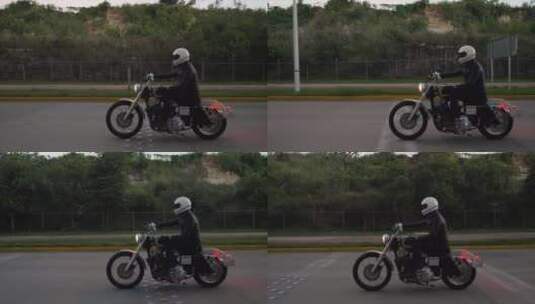 在高速公路上行驶的摩托车手高清在线视频素材下载