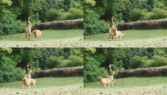 亚洲美女和宠物狗金毛犬在公园里奔跑慢镜头高清在线视频素材下载