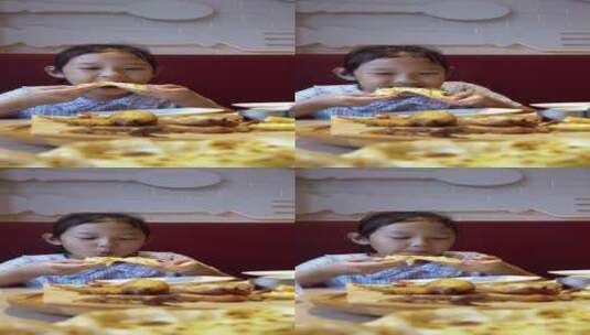 4K升格实拍大口吃披萨的女孩高清在线视频素材下载
