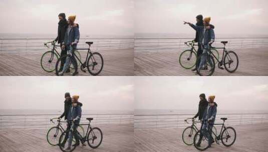 情侣推着自行车在桥上散步高清在线视频素材下载