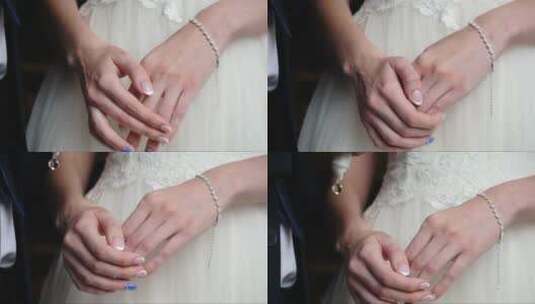 新娘双手放在膝盖左手戴着漂亮的珍珠手镯高清在线视频素材下载