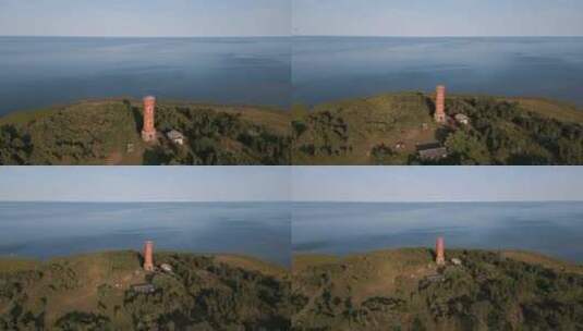 从波罗的海海岸的旧失落之地灯塔飞走无人驾驶飞机高清在线视频素材下载
