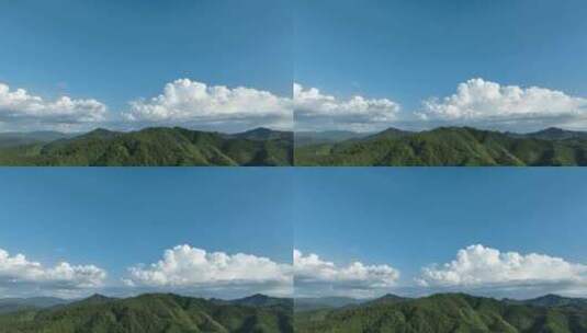 森林航拍山峰云朵山脉原始森林蓝天白云风景高清在线视频素材下载