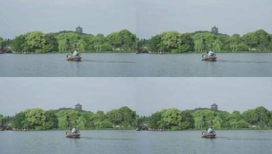 西湖里的手摇船游船高清在线视频素材下载