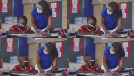 女老师辅助男孩完成家庭作业高清在线视频素材下载